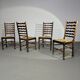 Ensemble de 4 chaises de salle à manger en chêne, rustiques, de ferme, à dossier en échelle avec sièges en jonc, années 1960