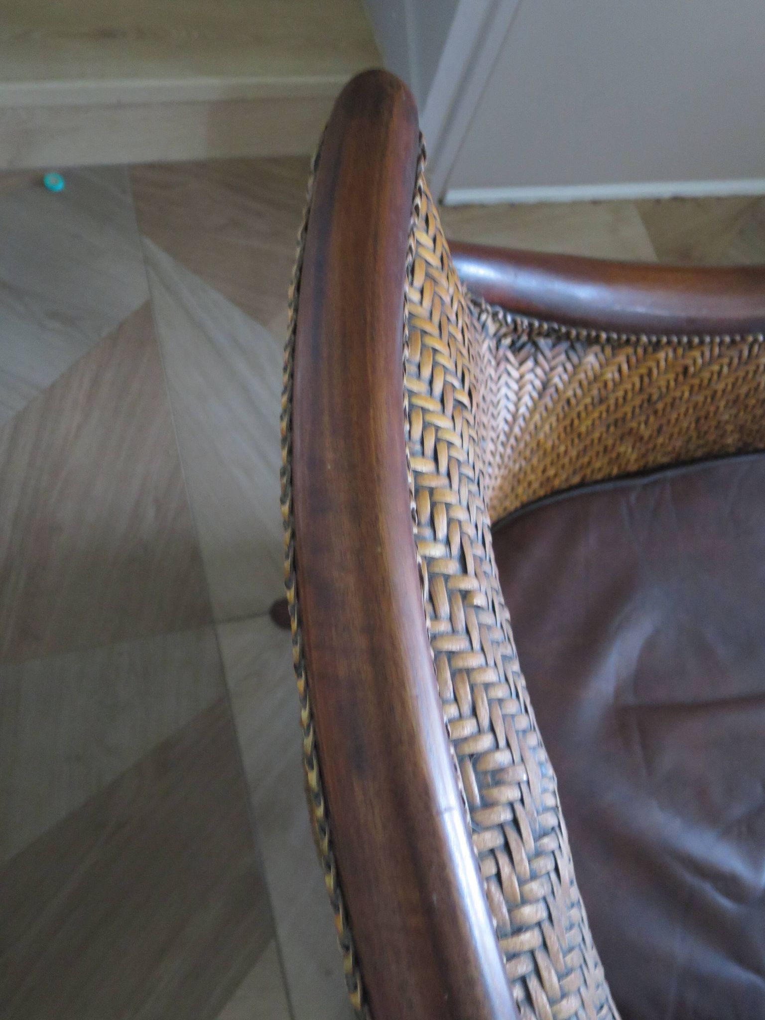 Woven rattan armchair and exotic wood in colonial style, 1980s.