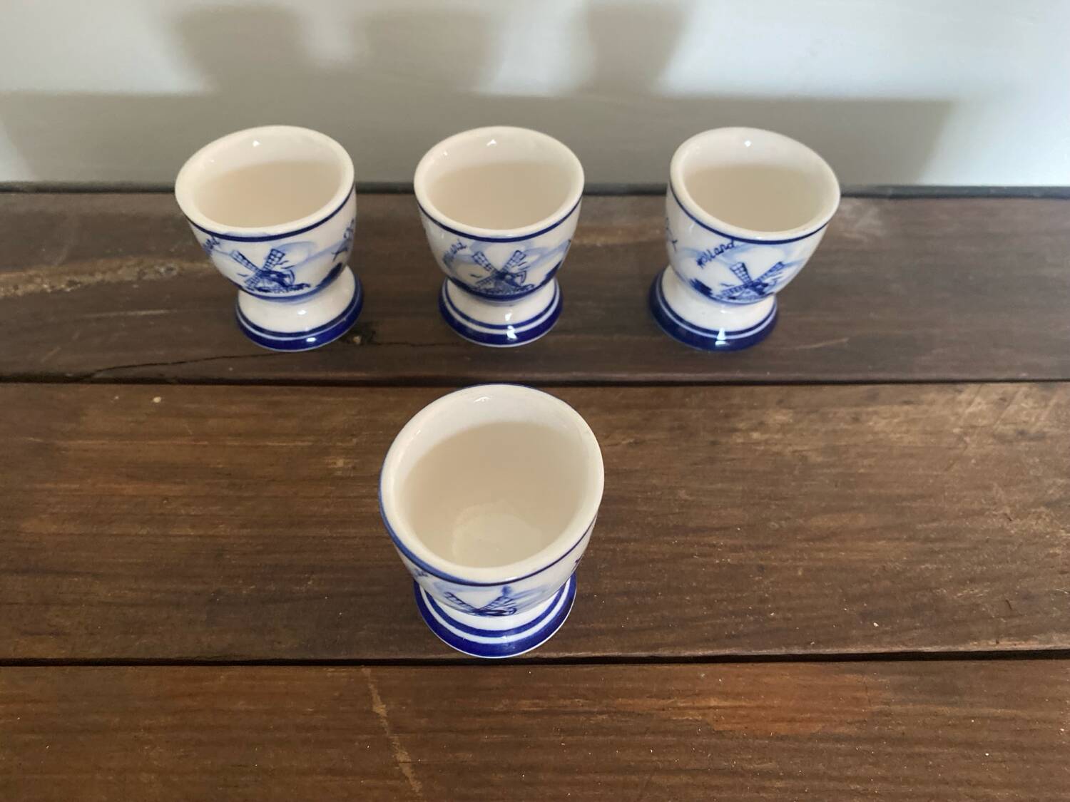 Set of 4 antique delft egg cups, white ceramic with blue vinta decor