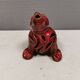 Beautiful seal in ceramic with metallic red glaze.