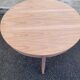 Renovated round extendable Scandinavian dining table in teak, 153cm.
