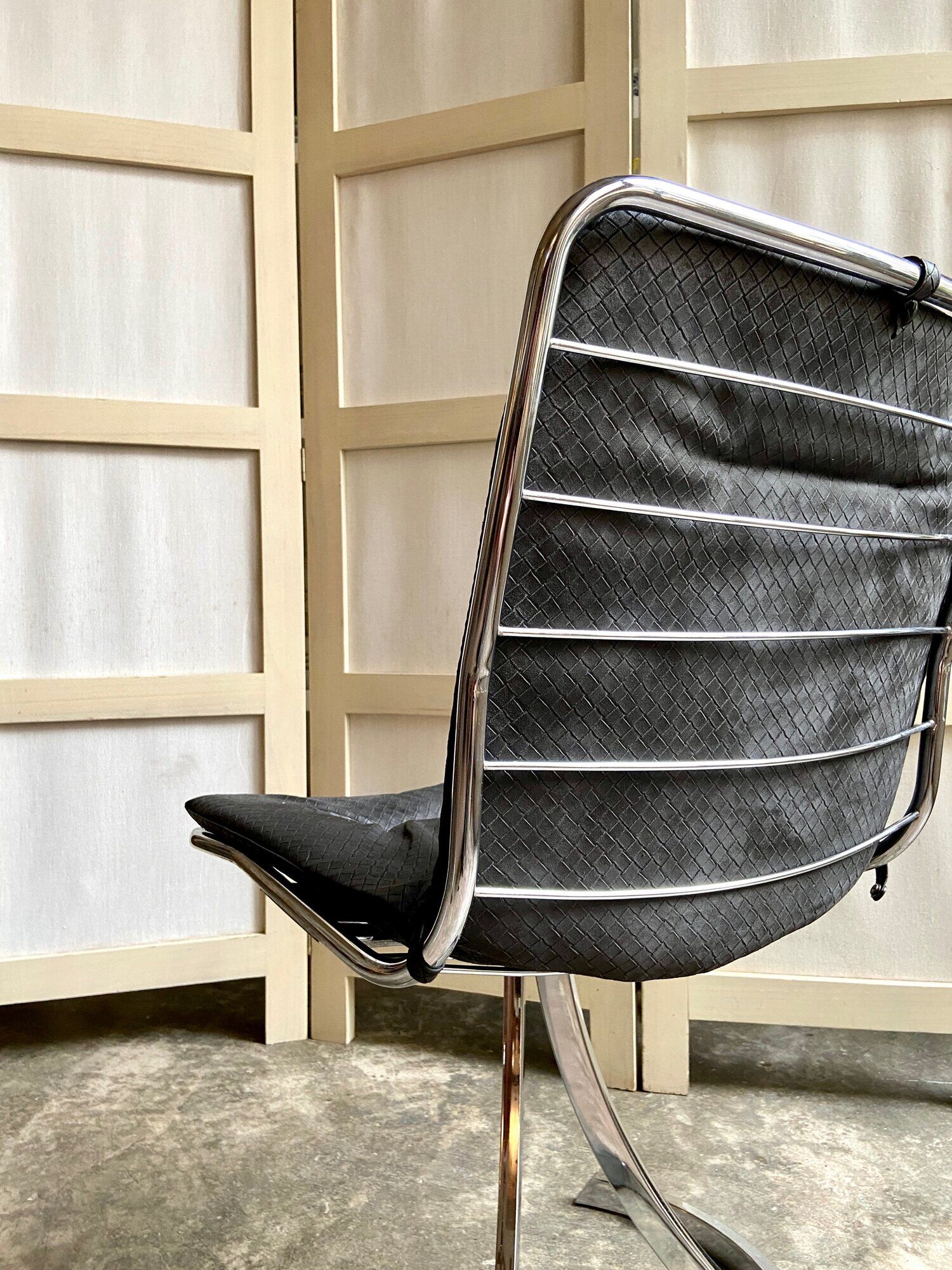 2 chairs in chromed metal and black woven skaï 1970s