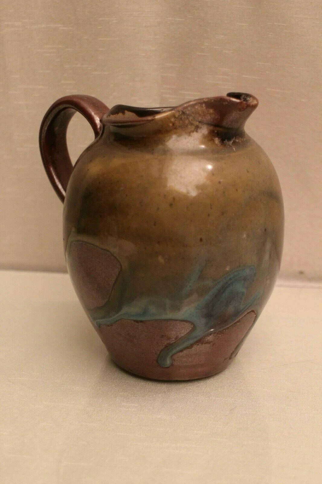 Pitcher in glazed sandstone