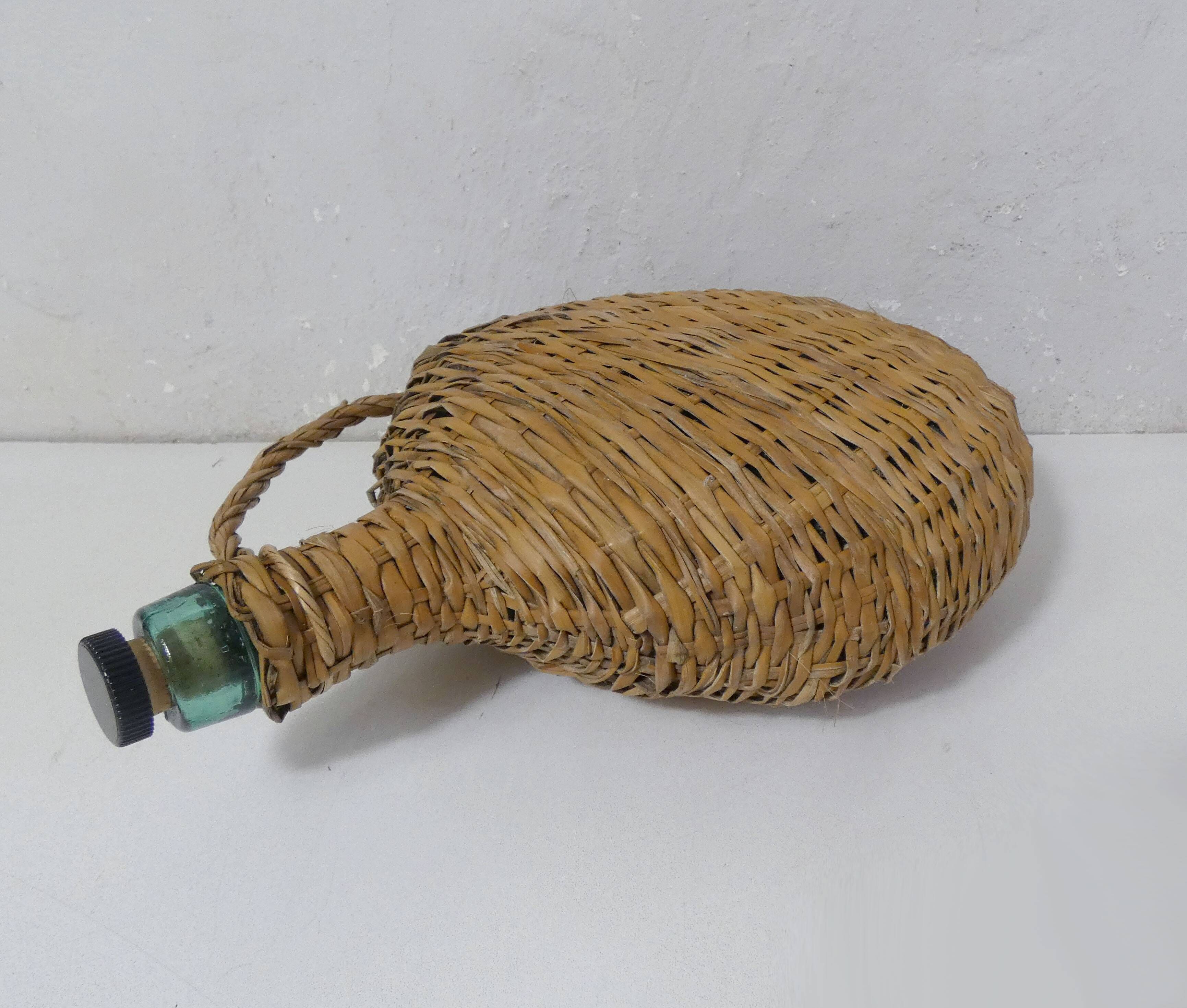 old bottle dressed in rattan vintage pilgrim gourd