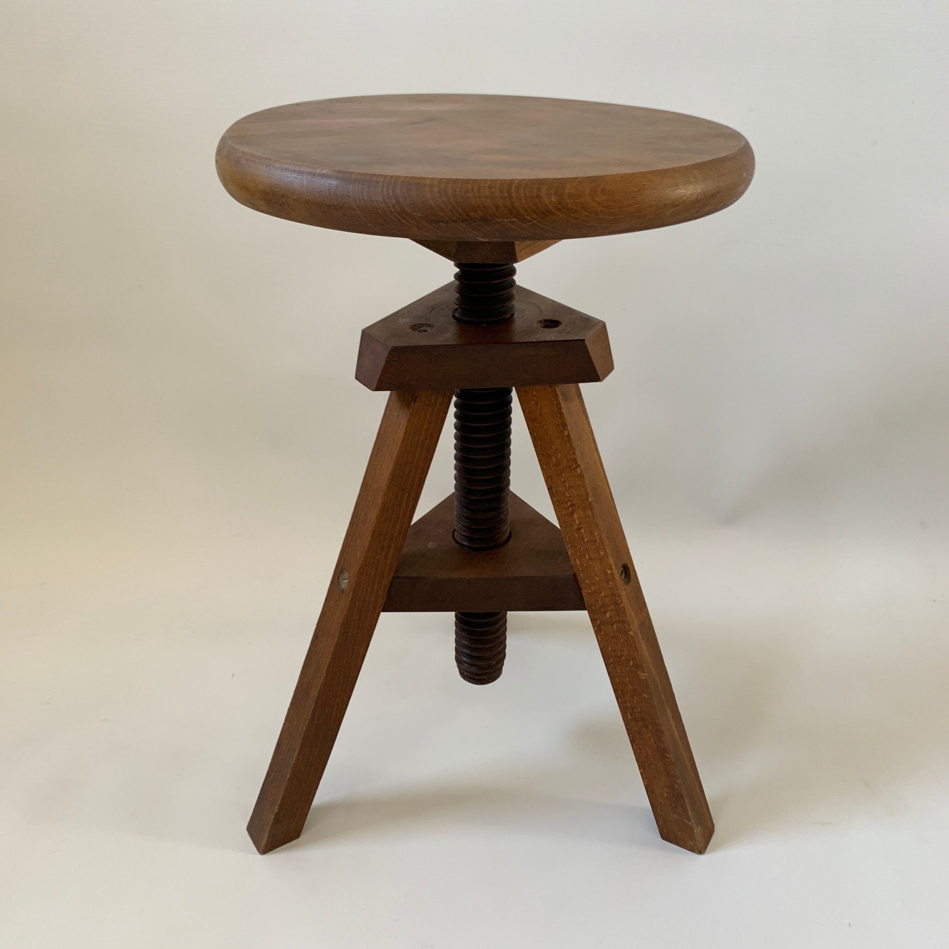 Wooden tripod stool with vintage screw