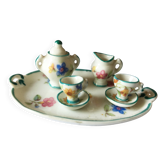 Small antique tea set in porcelain for children.