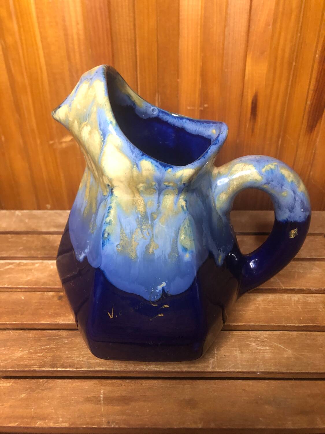Old vintage blue ceramic pitcher
