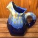 Old vintage blue ceramic pitcher