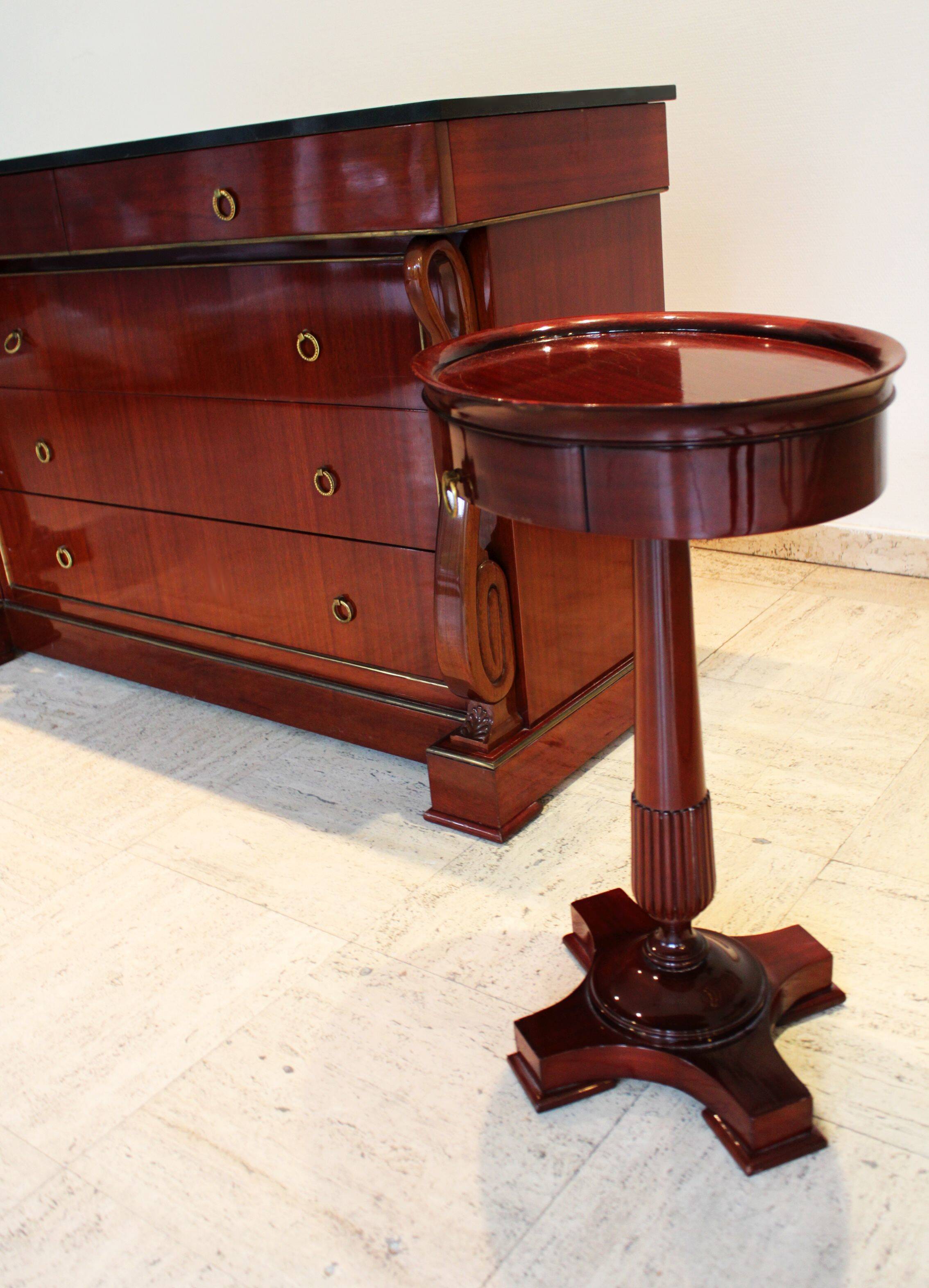 Mahogany “swan neck” chest of drawers, Empire style, 19th century.