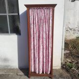 Old wardrobe in old wood and vintage fabric
