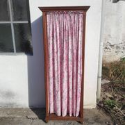 Old wardrobe in old wood and vintage fabric