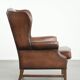 Cowhide wingback armchair in English style finished with decorative nails