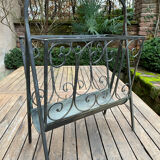Art Deco magazine rack in wrought iron with bronze patina from around 1930-1940.