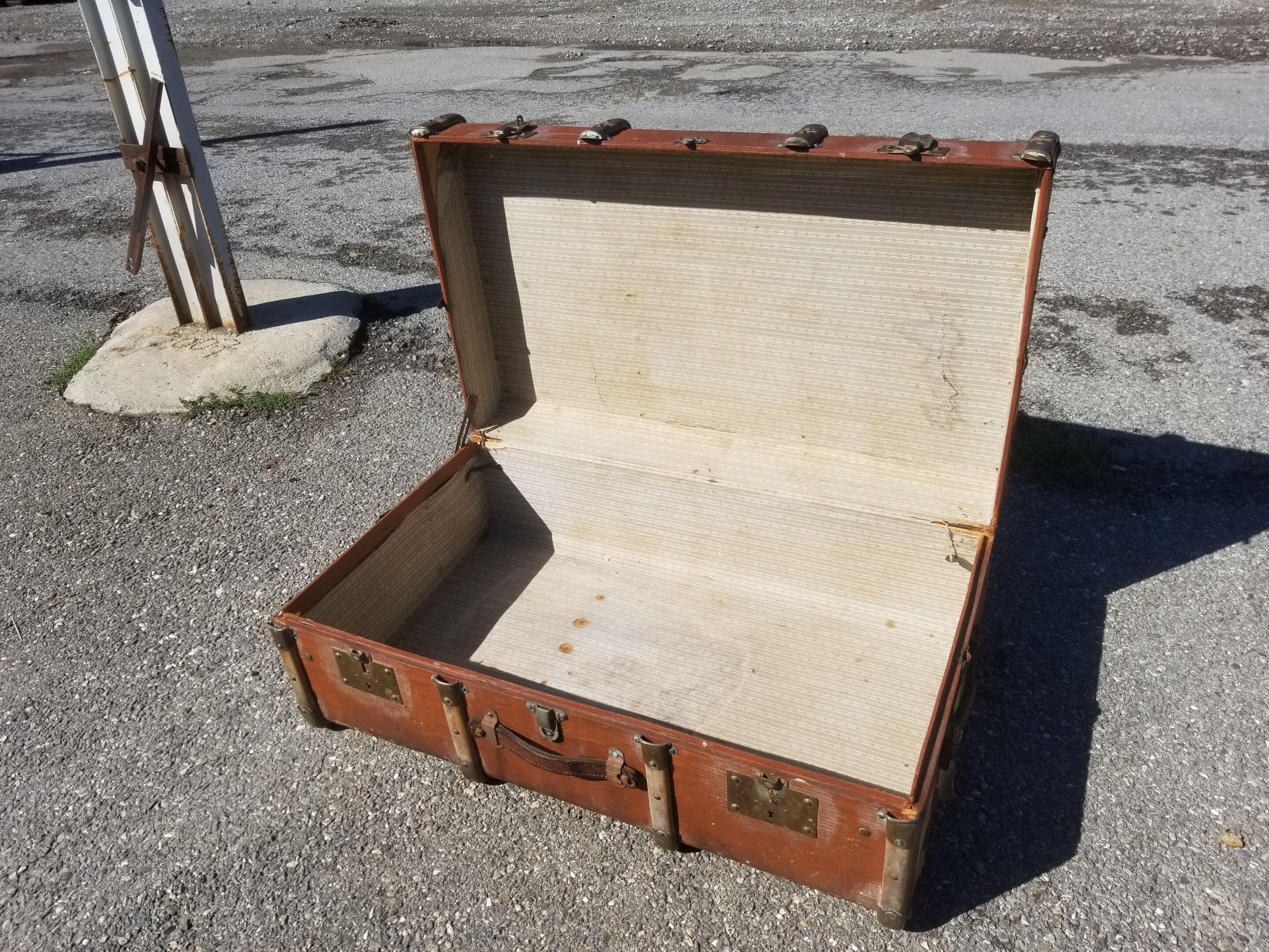 Old travel trunk made of wood and brass