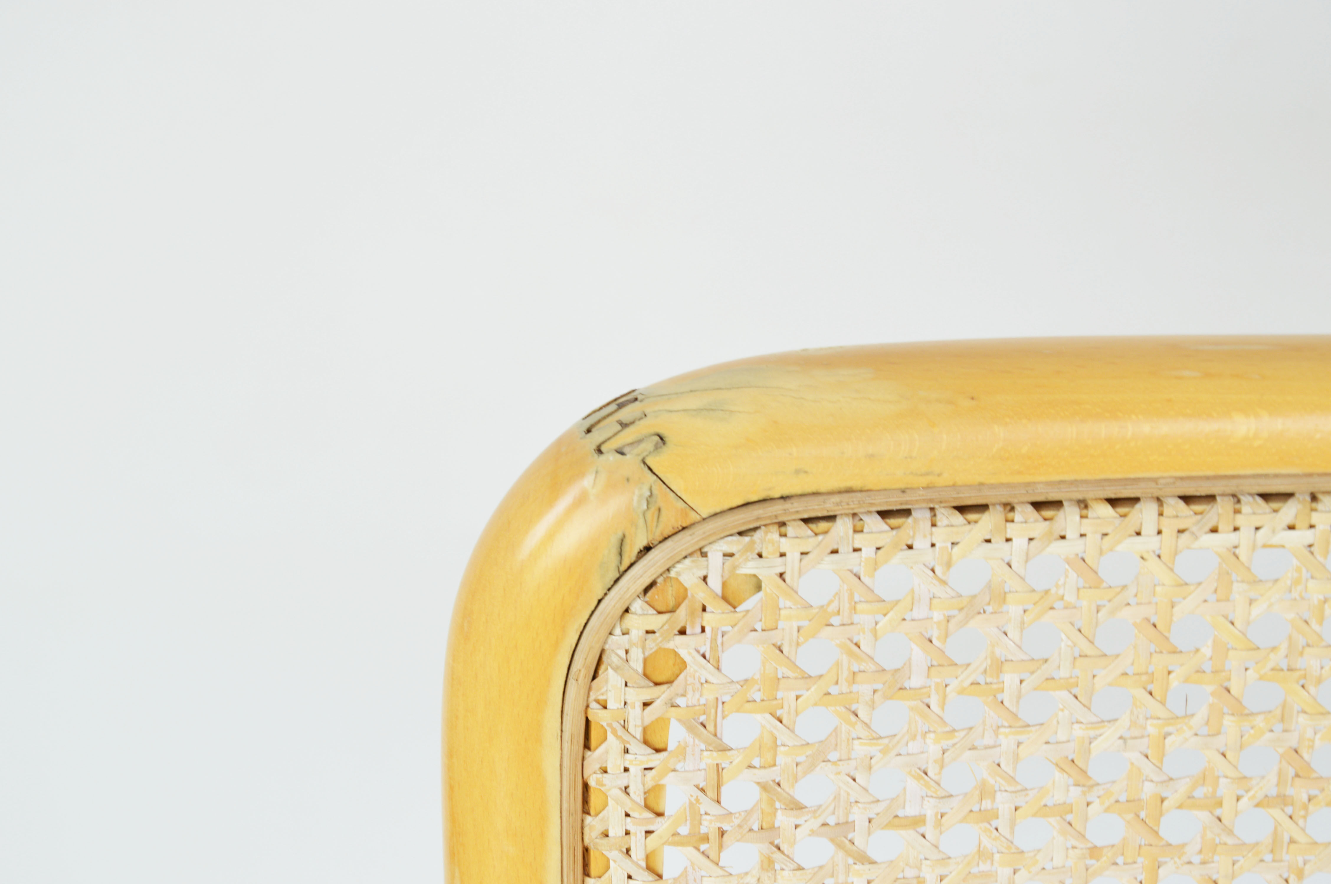 A pair of chairs with armrests, 1970s