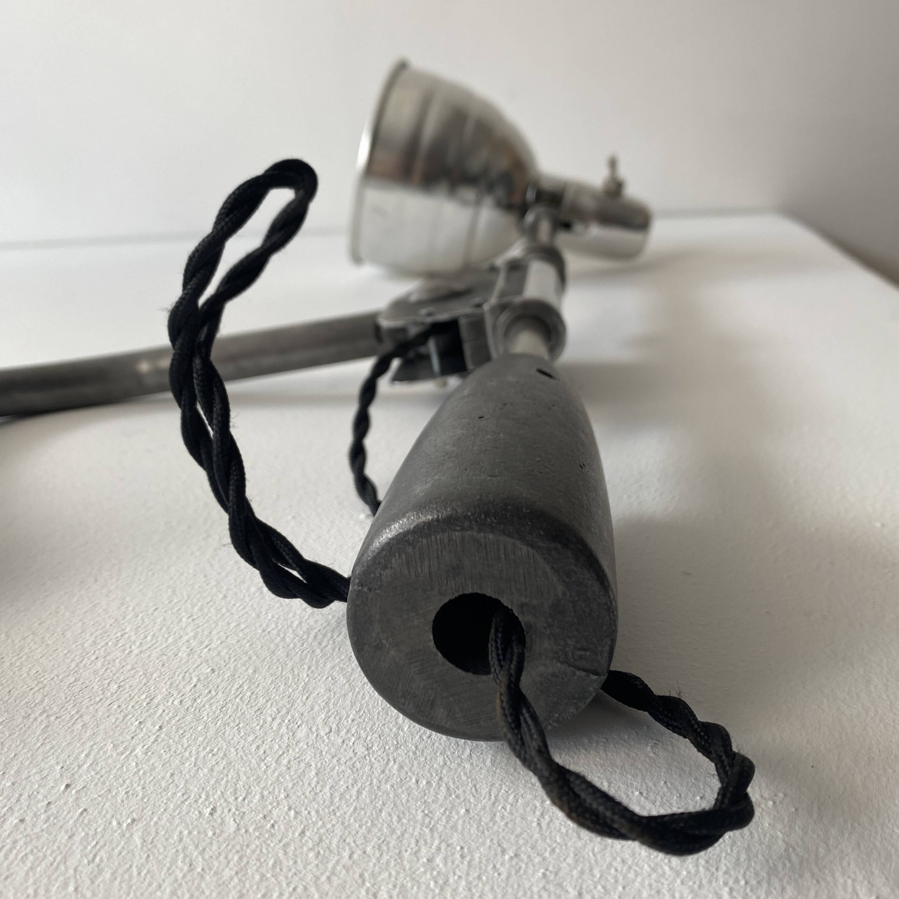 Old industrial wall light with counterweight.