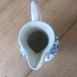 Small old pitcher in iron earth