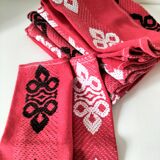 Vintage graphic red tablecloth and 8 matching napkins.