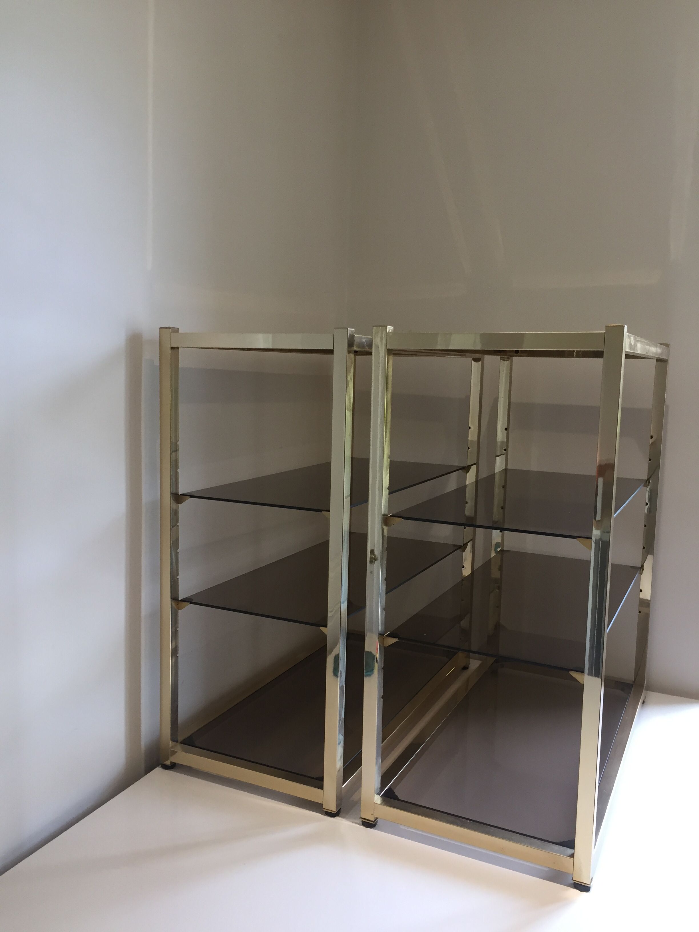 Pair of consoles brass shelves and smoked glass design Roche Bobois