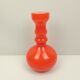 Orange glass vase and white interior