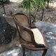 Old wooden armchair and cannage