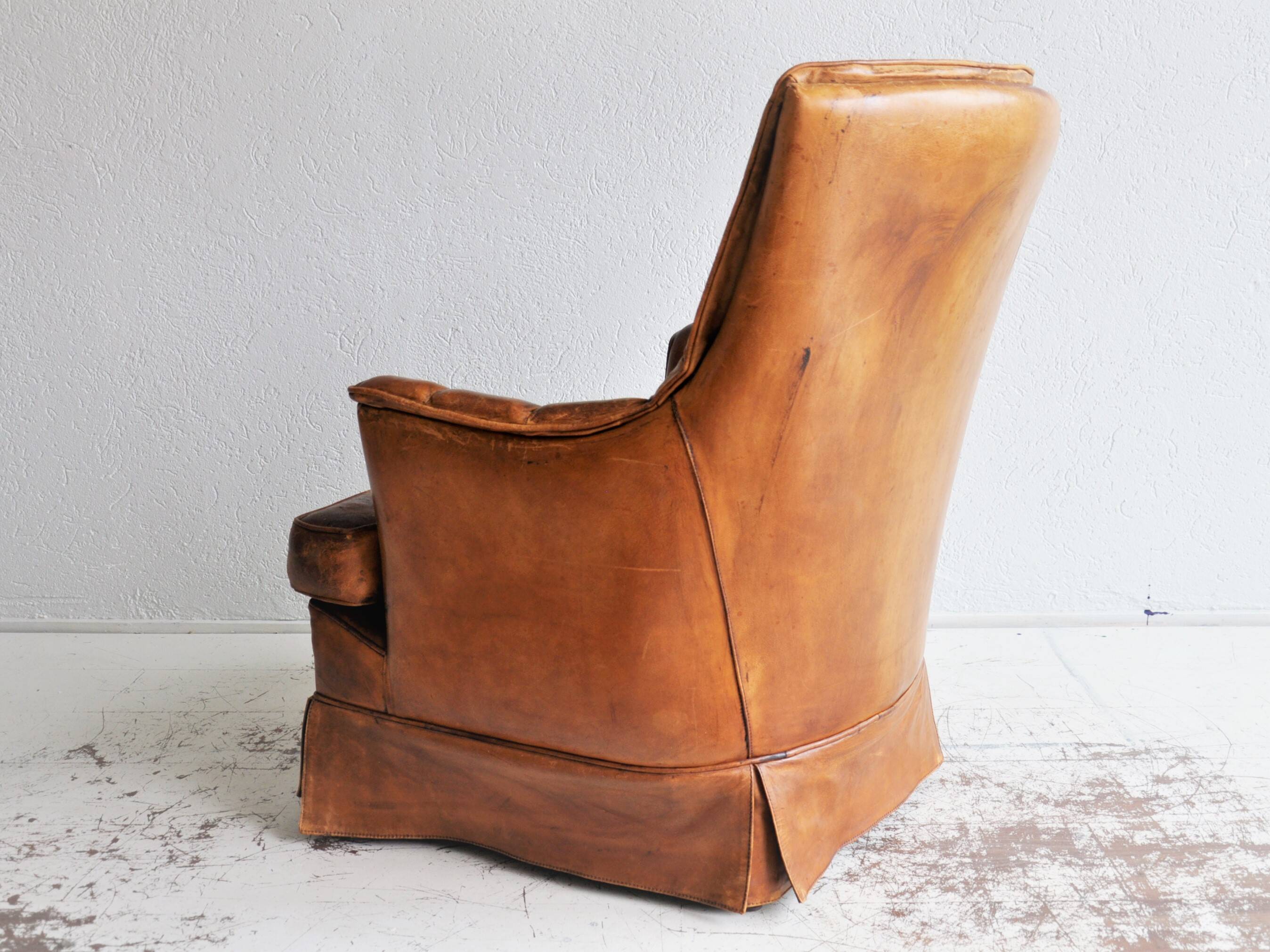 Vintage sheap leather armchair,  large smoker chair in brown sheapleather, Big leather fauteuil