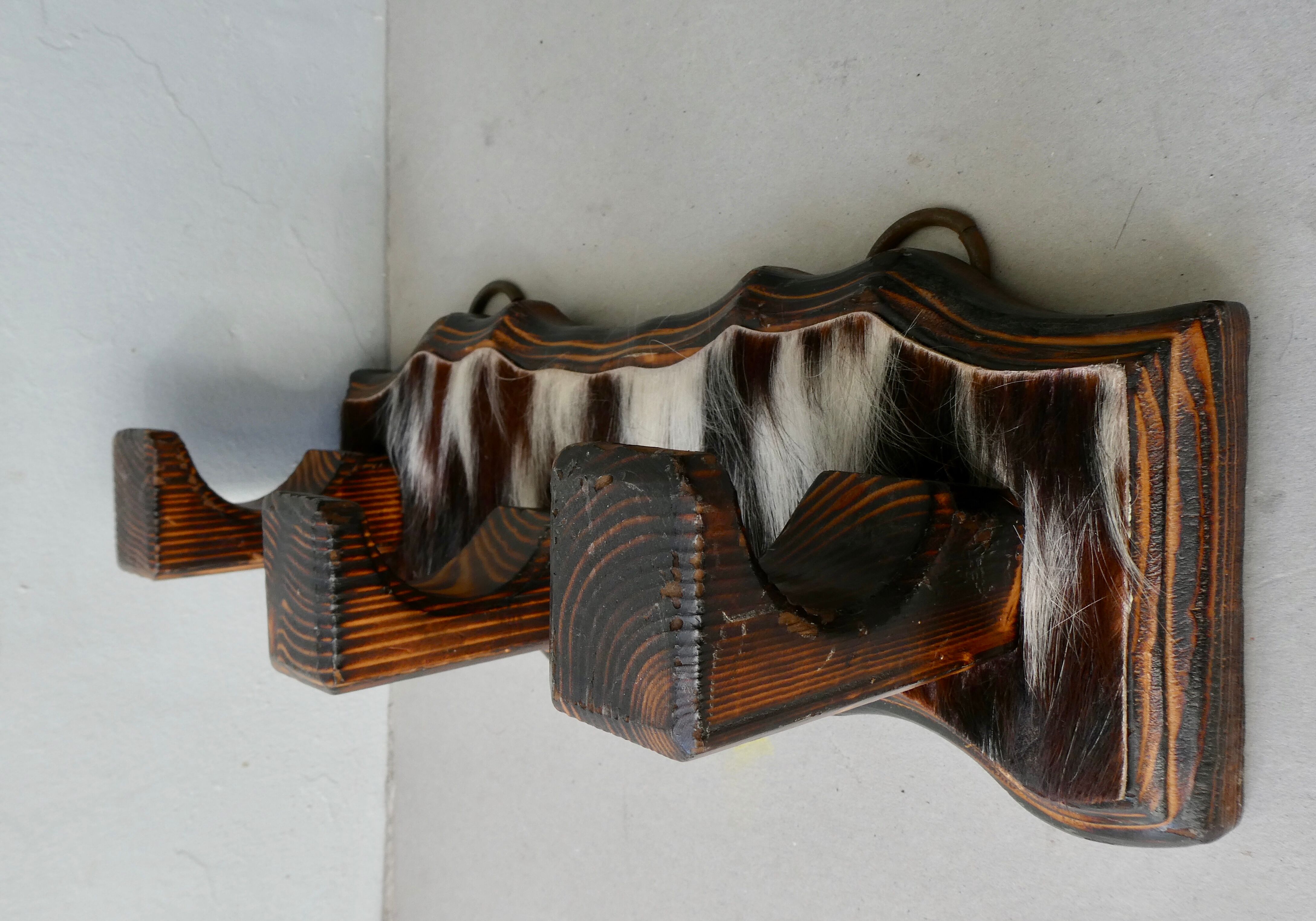 Wall hanger in burnt pine and cow skin