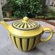 Teapot in yellow and black porcelain stamped Sarreguemines