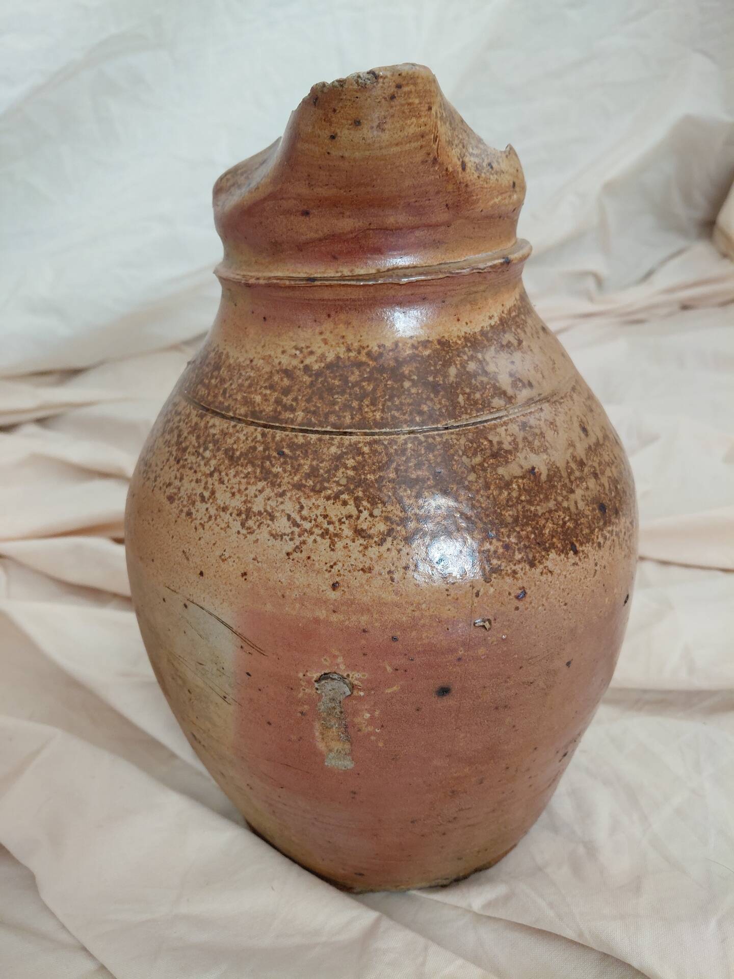 Old farm jug in glazed stoneware