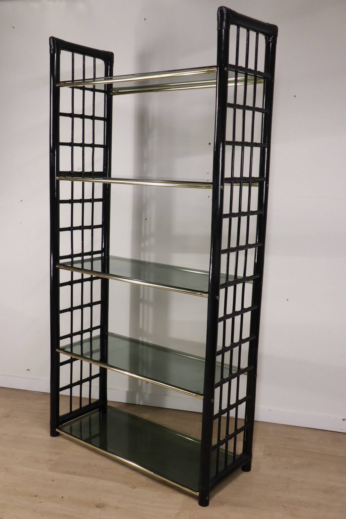 Vintage 1970s shelf in smoked glass with a bamboo-style structure.