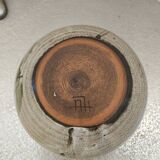 Covered enameled earthenware pot