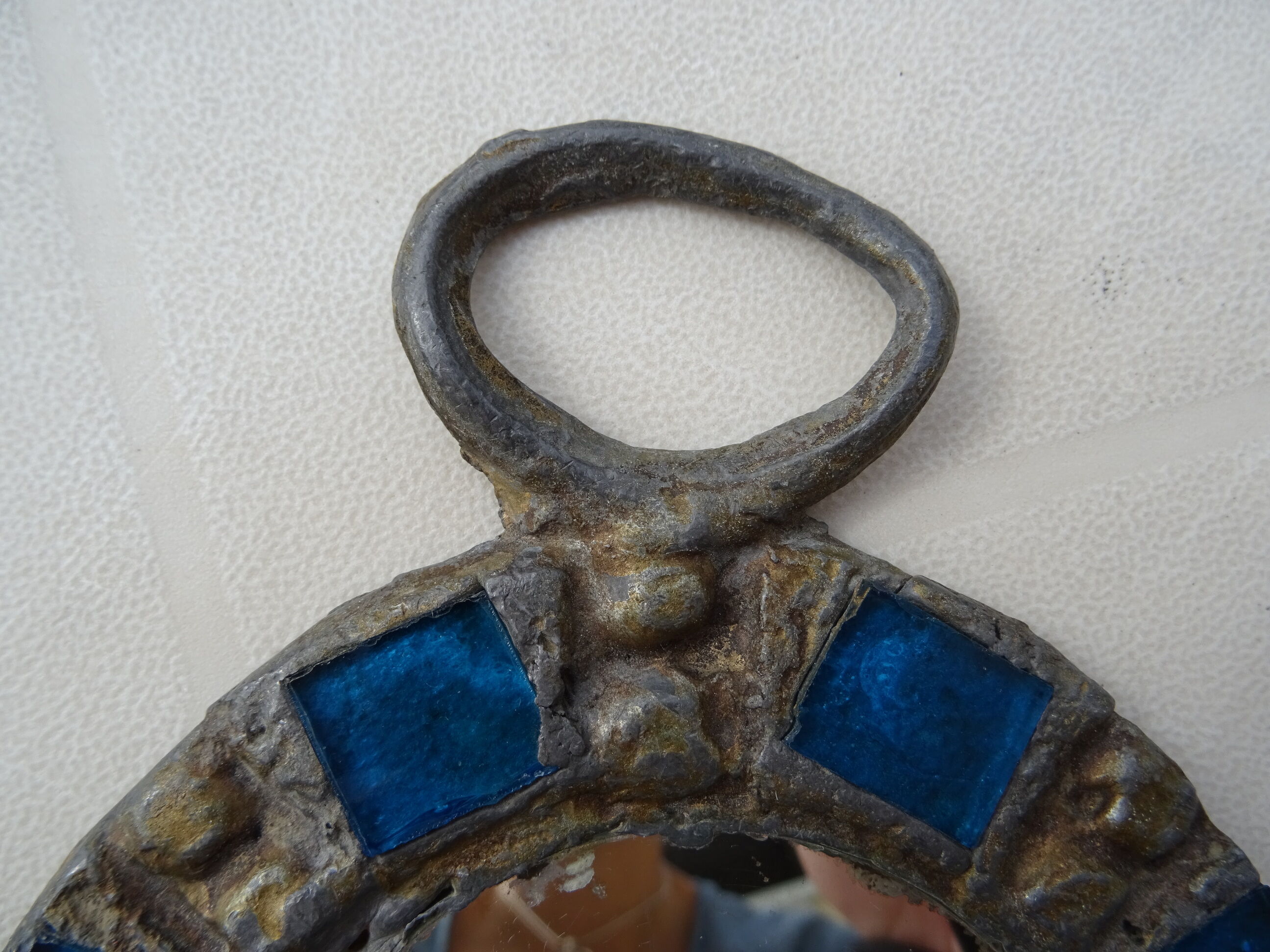 Mirror in metal and blue glass