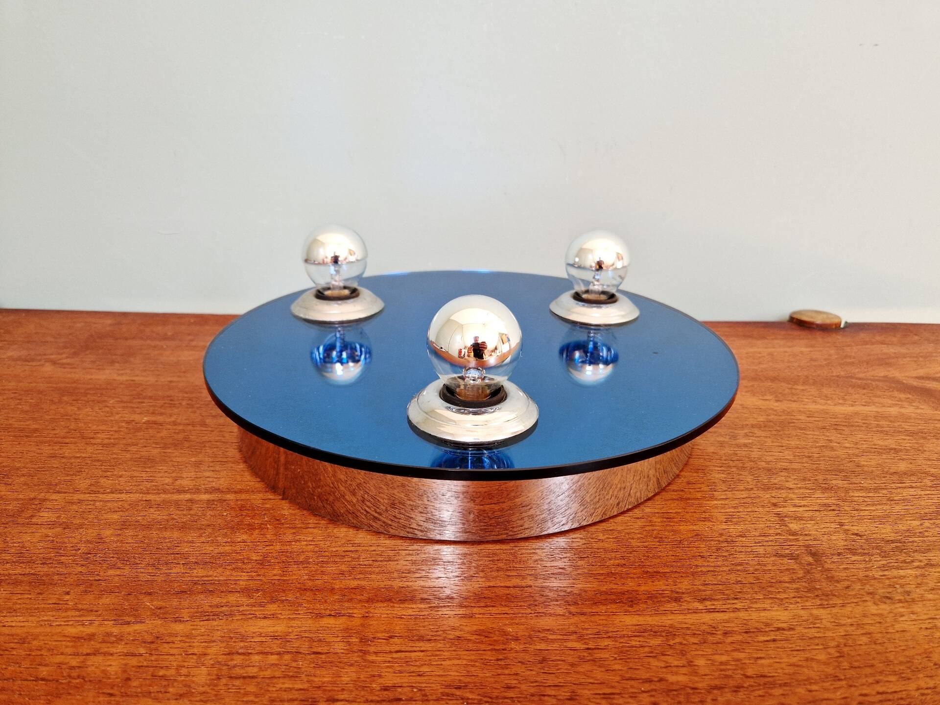 Space Age ceiling light/wall sconce, blue-tinted mirror glass, 1970.