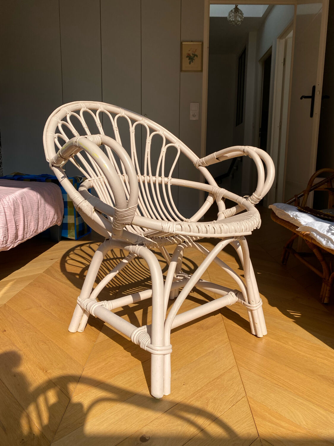 Shell chair in pale pink painted rattan