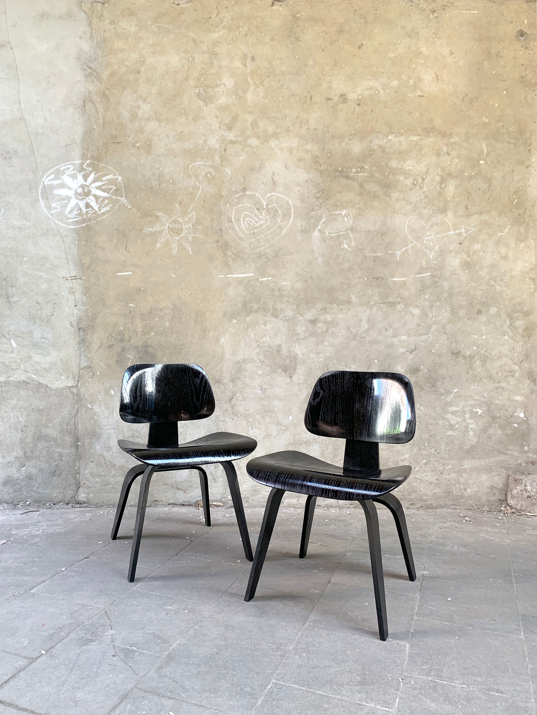 Pair of DCW chairs by Charles & Ray Eames in Black for Herman Miller 1950