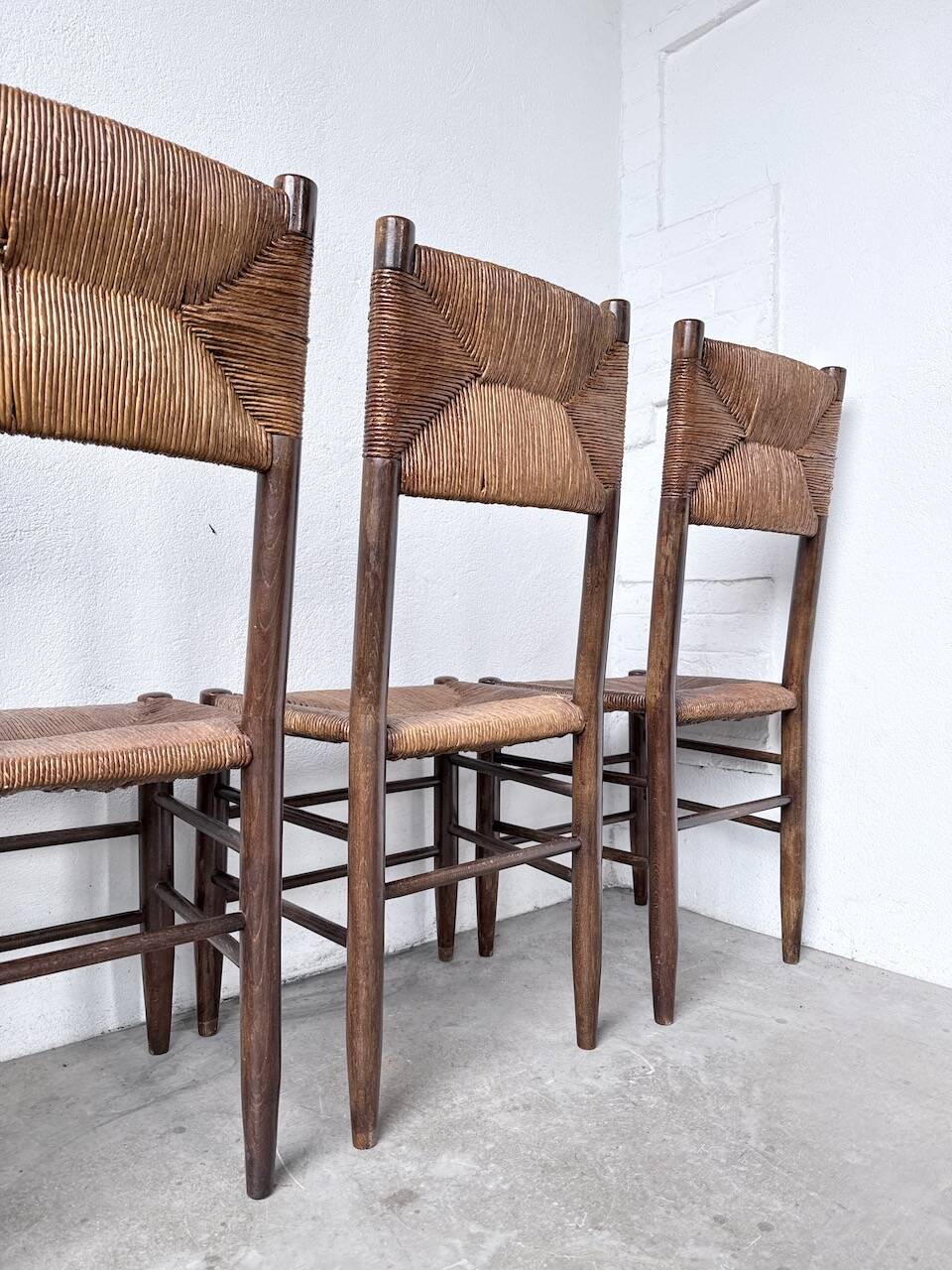 Set of 6 straw and oak Beauche chairs.