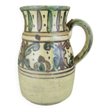 Glazed earthenware pitcher signed Riou.