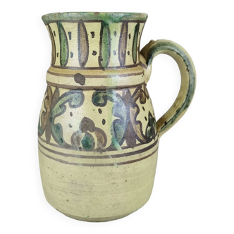 Glazed earthenware pitcher signed Riou.