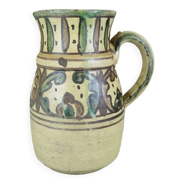 Glazed earthenware pitcher signed Riou.
