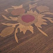 Antique marquetry side table in wood and cane.