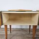 Mid-century nightstands in maple, brass, and glass