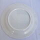 Set of 4 white and blue dinner plates.