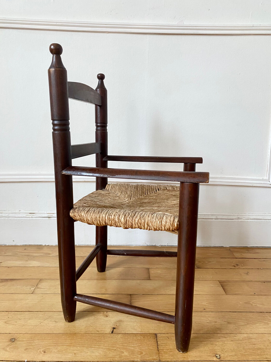Wooden chair and children's straw