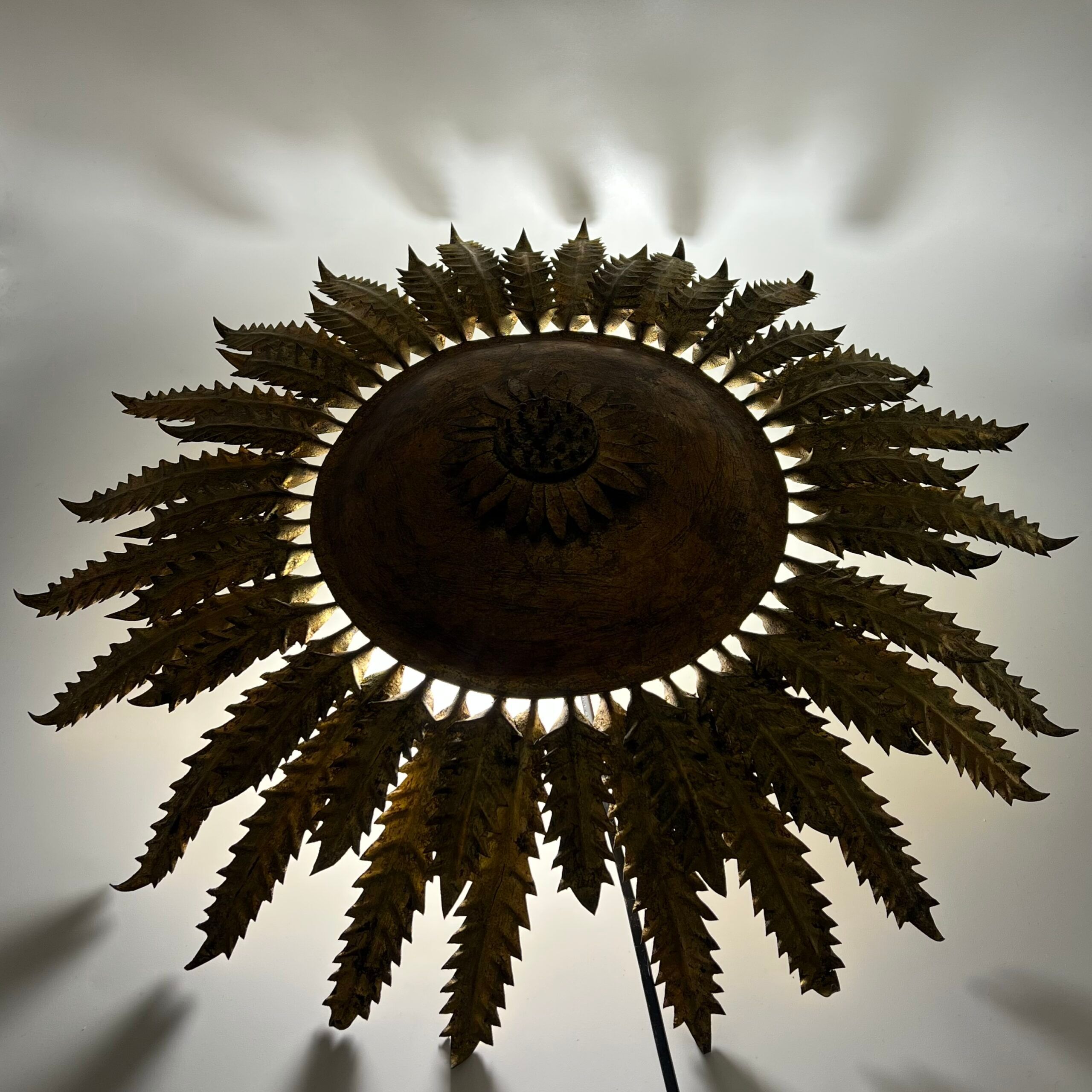 Large wall sconce "Sol" in gilded wrought iron – Spain, 1950s