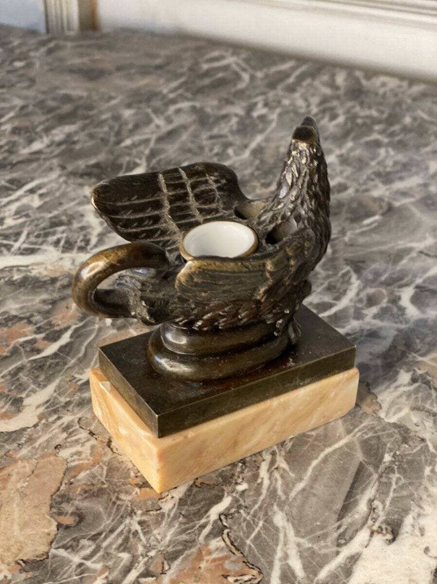 Eagle and serpent, bronze inkwell on a marble base.