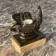 Eagle and serpent, bronze inkwell on a marble base.