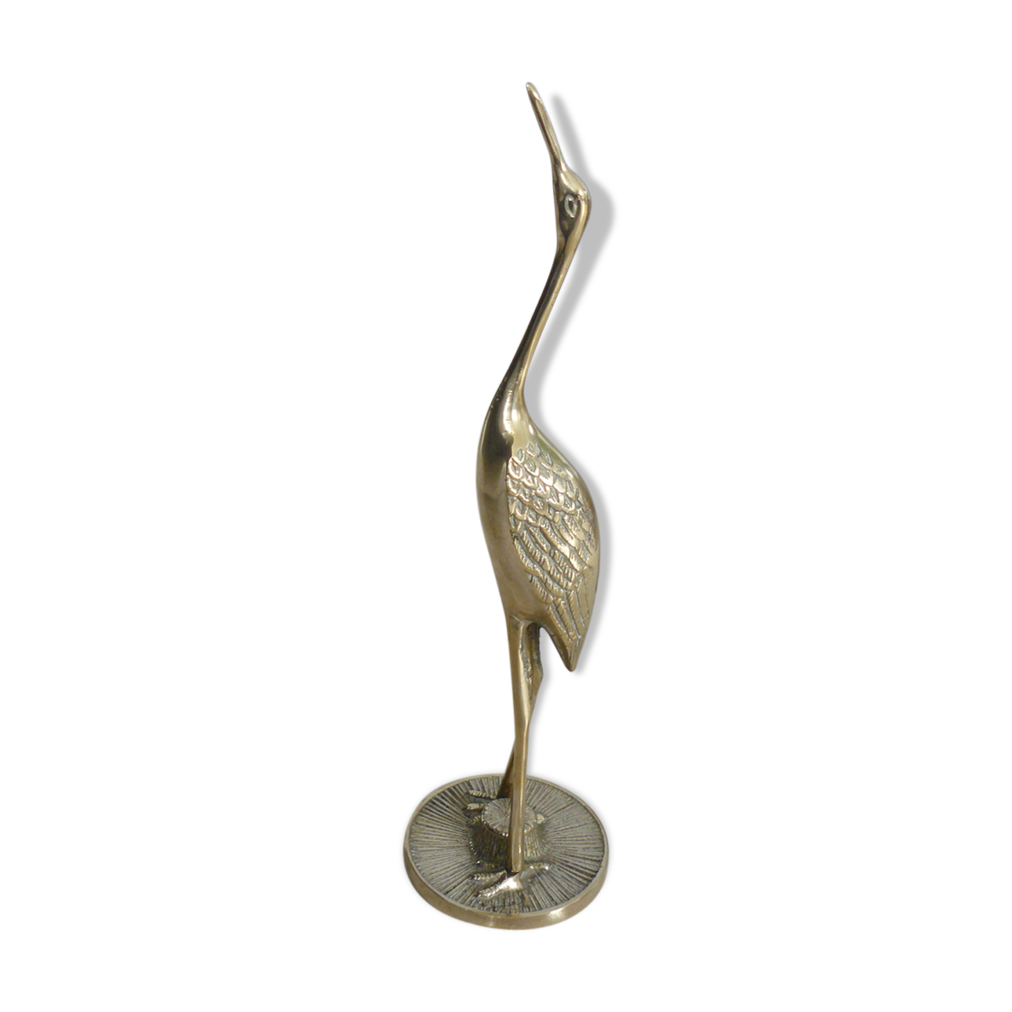 Heron in vintage brass