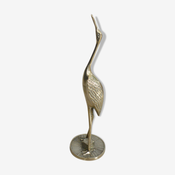 Heron in vintage brass