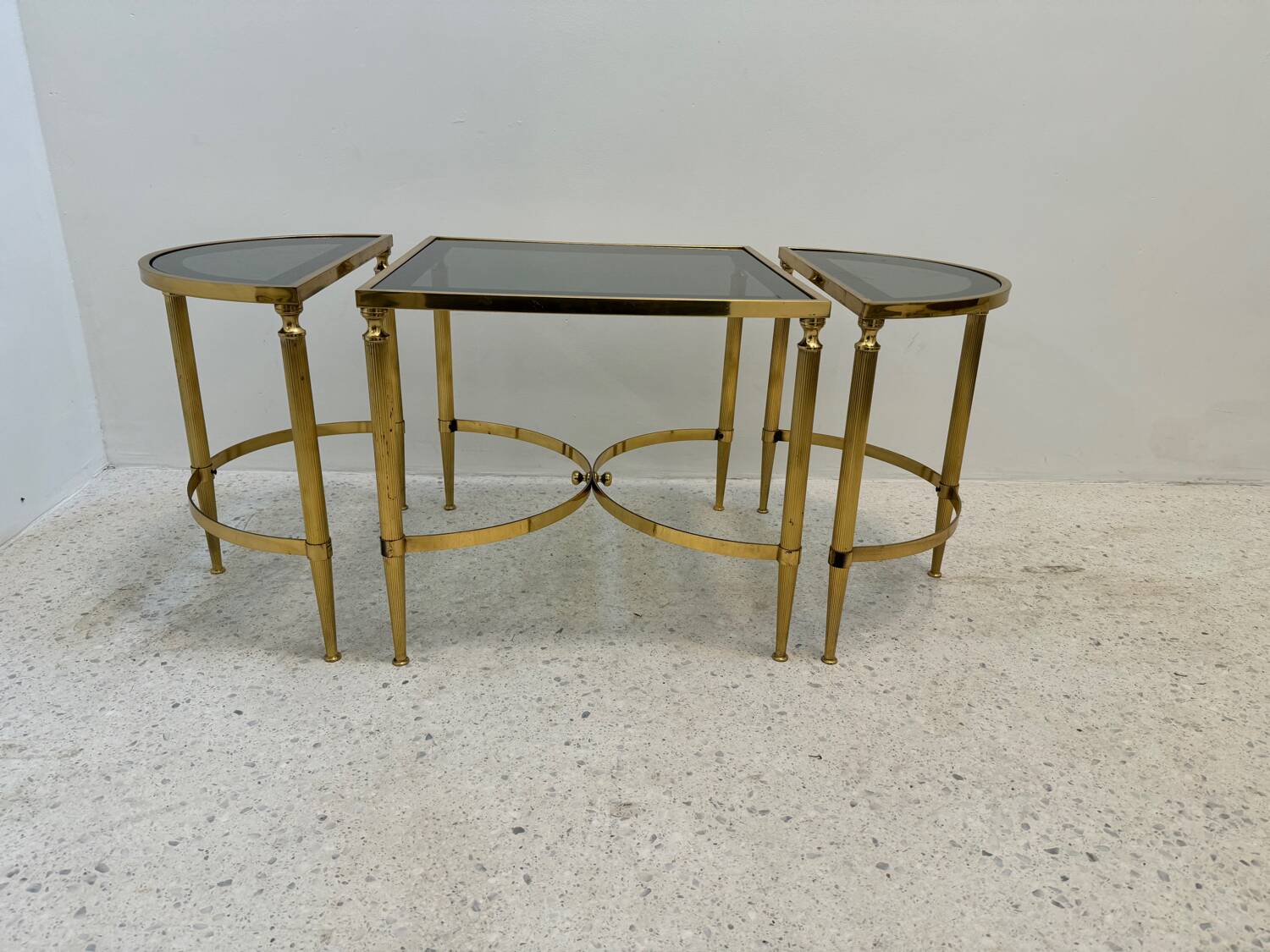 Neo classic coffee table in brass and smoked glass