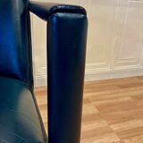 Set of 3 designer leather and metal armchairs.